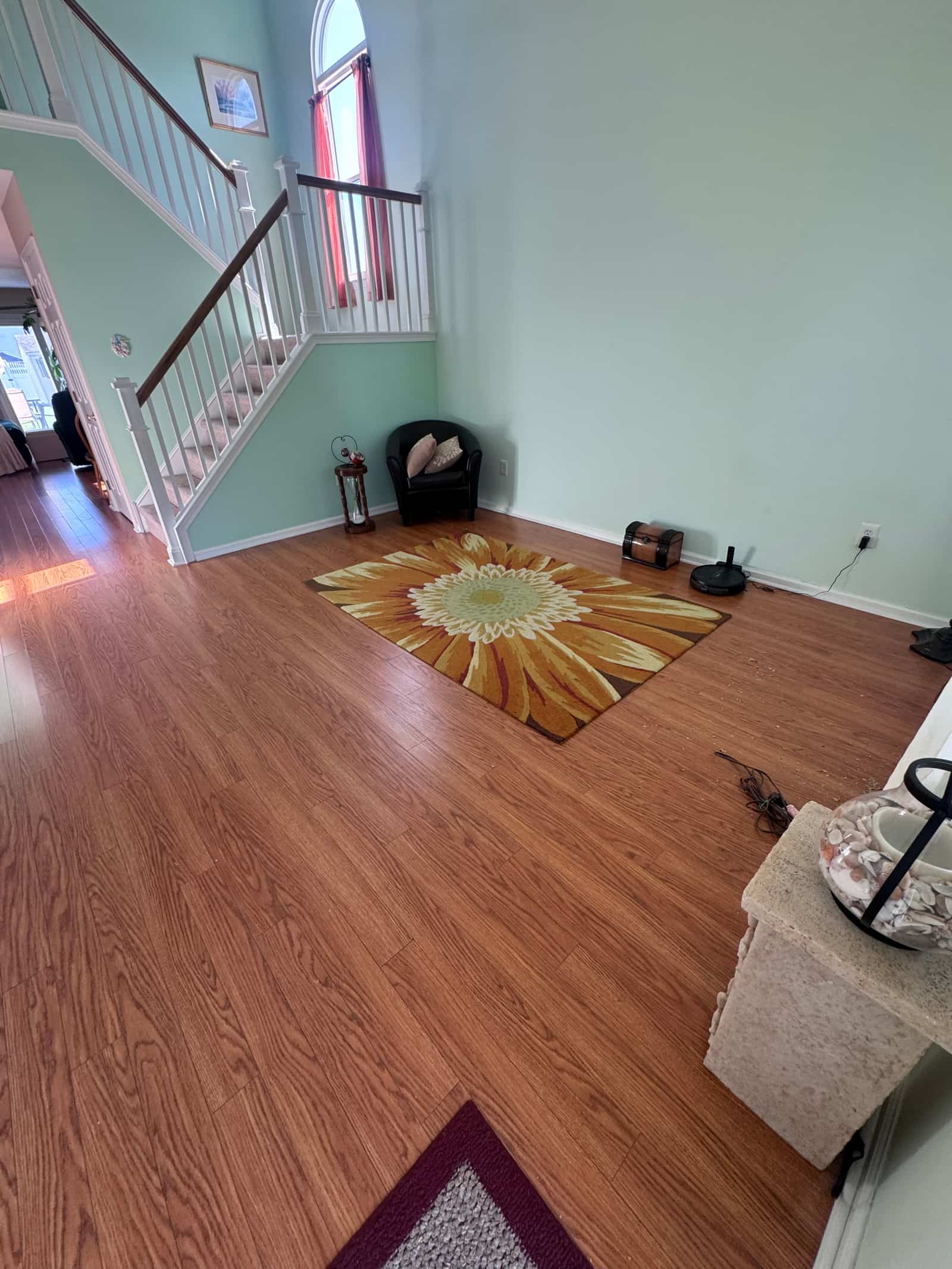 The same Middletown living room cleared, clean floor and open space